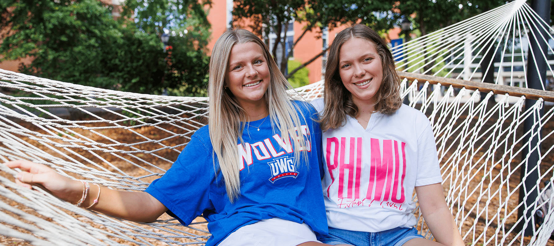 two female students smiling 